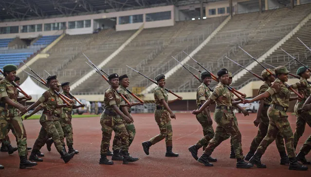 Zimbabwean military leave after a dress rehearsal ahead of Friday's presidential inauguration of Emmerson Mnangagwa, at the National Sports Stadium in Harare, Zimbabwe, Thursday, November 23, 2017. Zimbabwe on Thursday was making preparations to swear in a new leader after 37-years of Robert Mugabe rule. (Photo by Ben Curtis/AP Photo)