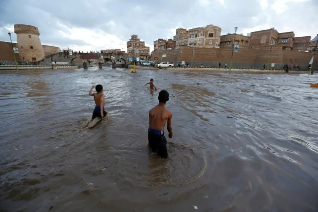 Boys play in flood water in the Old City of Sanaa, Yemen August 2, 2016. (Photo by Khaled Abdullah/Reuters)