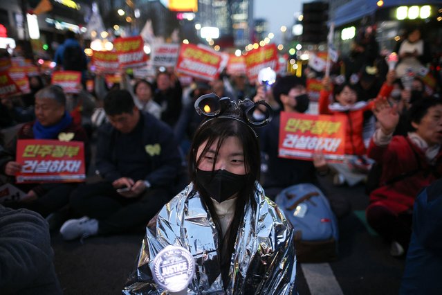 People attend a rally to celebrate expulsion of impeached President Yoon Suk Yeol, in Seoul, South Korea, on April 4, 2025. (Photo by Kim Hong-ji/Reuters)