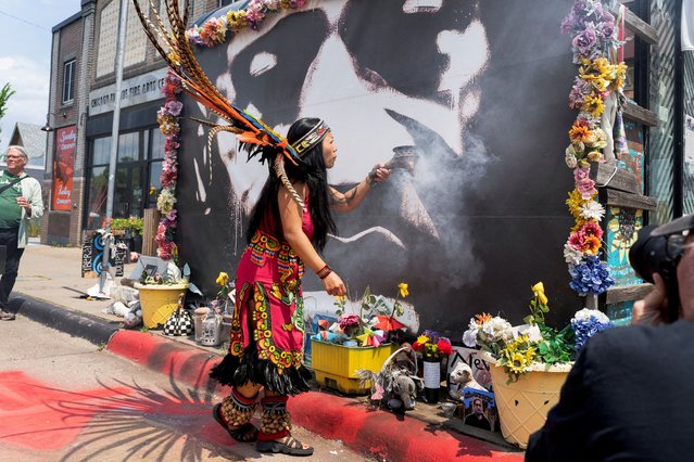 A member of the Kalpulli Yaocenoxtli Aztec group performs a traditional dance at the George Floyd memorial site on the fifth anniversary of the murder of Floyd by former police officer Derek Chauvin in Minneapolis, Minnesota, on May 25, 2025. (Photo by Lucy Baptiste/Reuters)