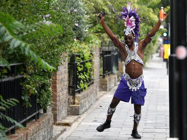 A reveller dressed in carnival costume dances after the normal Notting Hill Carnival festivities was cancelled amid the coronavirus disease (COVID-19) outbreak, in London, Britain, August 31, 2020. (Photo by Toby Melville/Reuters)