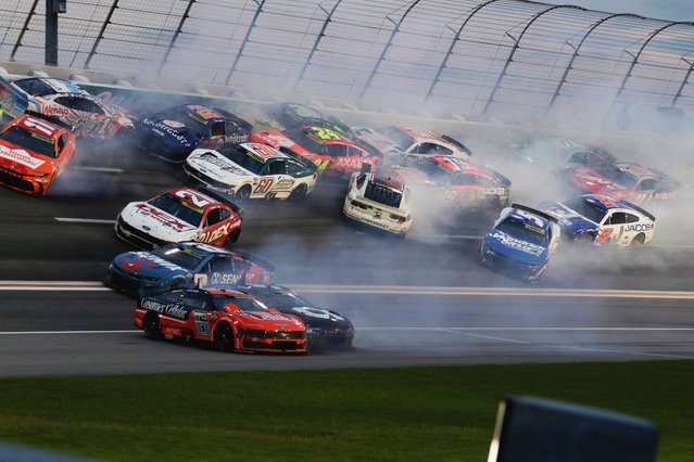 Twenty plus cars tangle up in turn three of lap sixty nine during a NASCAR Cup Series auto race, Saturday, June 28, 2025, in Hampton, Ga. (Photo by Russell Norris/AP Photo)