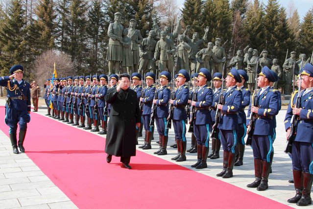 North Korean leader Kim Jong Un inspects an honour guard as he visits the Korean People's Army pilots who have completed a tour of battle sites in the area of Mt Paektu, in this undated photo released by North Korea's Korean Central News Agency (KCNA) on April 19, 2015. (Photo by Reuters/KCNA)