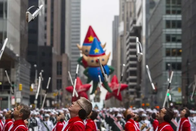Members of the Madison Scouts perform during the 88th Annual Macy's Thanksgiving Day Parade in New York November 27, 2014. (Photo by Andrew Kelly/Reuters)