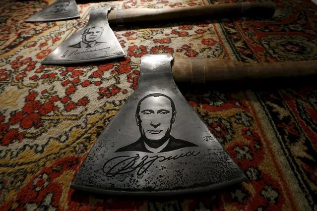 An art object depicting a portrait of Russian President Vladimir Putin from the installation "History of Russia in Axes" by Russian artist Vasily Slonov is seen on display during an exhibition titled "Quilted Cavaliers of the Apocalypse" at the Winzavod center of contemporary art in Moscow, Russia, October 24, 2015. (Photo by Sergei Karpukhin/Reuters)
