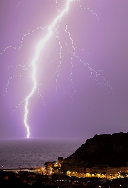 Lightning strikes over the French Riviera city of Nice, Southern France, on September 5, 2022. (Photo by Valery Hache/AFP Photo)