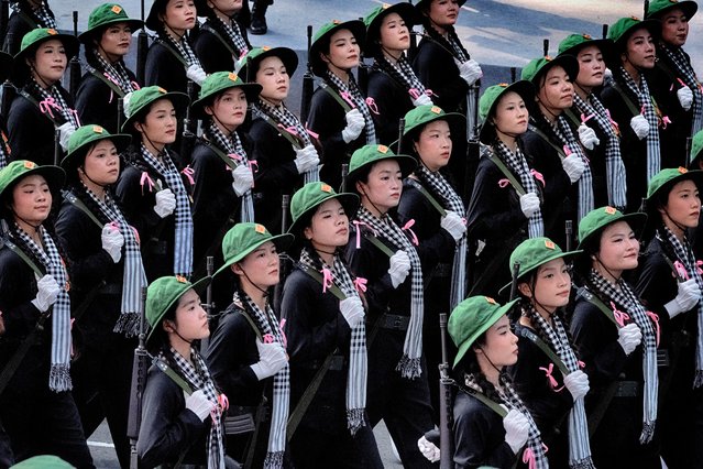 Women soldiers in North Vietnamese Army costumes march during a parade celebrating the 50th anniversary of the end of the war on Wednesday, April 30, 2025, in Ho Chi Minh City, Vietnam. (Photo by Richard Vogel/AP Photo)