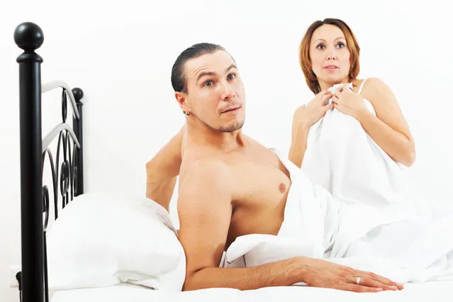 Terrified couple caught during sеx in bed. (Photo by Alamy Stock Photo)