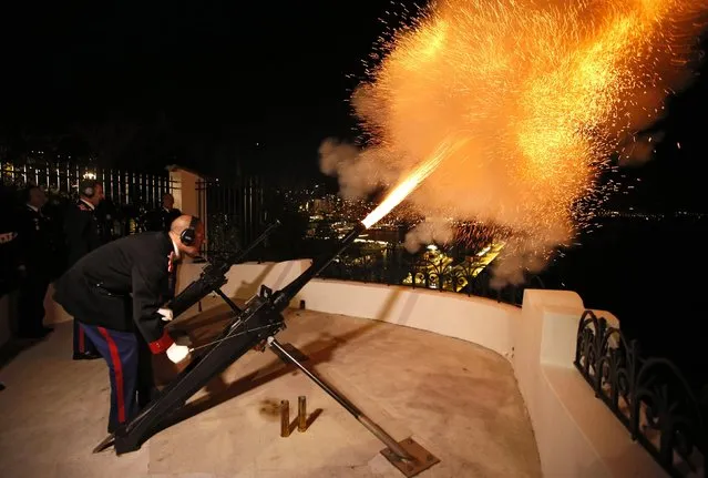 Carabiniers of Monaco's Prince Albert II fire canons to announce the birth of twins of Prince Albert II of Monoco and Charlene, in front of the Monaco Palace December 10, 2014. Princess Charlene of Monaco gave birth on Wednesday to a boy and a girl, the royal couple's first children, an aide to the royals said. According to Monaco's Constitution the boy, named Jacques, will be first-in-line to the throne, and not his twin sister, Gabriella. (Photo by Eric Gaillard/Reuters)