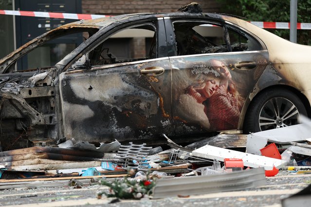 A damaged car near a building that was destroyed in an deadly overnight explosion in Düsseldorf, Germany on May 16, 2024. (Photo by Thilo Schmülgen/Reuters)
