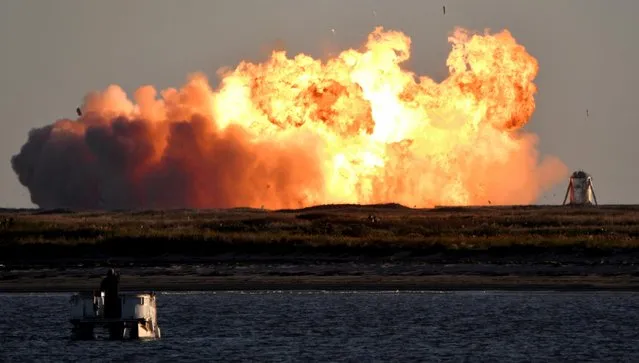 SpaceX's first super heavy-lift Starship SN8 rocket explodes during a return-landing attempt after it launched from their facility on a test flight in Boca Chica, Texas, December 9, 2020. The prototype exploded during a return-landing attempt, minutes after an apparently uneventful test launch from the company's facility. (Photo by Gene Blevins/Reuters)