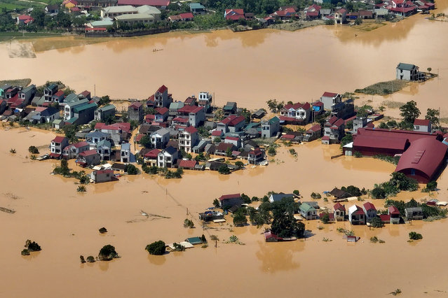This aerial photo shows a flooded village in That Khe commune after heavy rains caused by Typhoon Matmo in Lang Son province on October 8, 2025. Record floods submerged streets in several communities in Vietnam on October 8, with at least eight people killed this week, the government said. (Photo by Anh Tuc/AFP Photo)