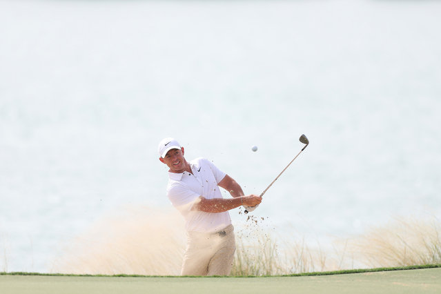 Rory McIlroy of Northern Ireland plays a shot from a bunker on the 18th hole on day one of the Abu Dhabi HSBC Championship 2025 at Yas Links Golf Course on November 06, 2025 in Abu Dhabi, United Arab Emirates. (Photo by Andrew Redington/Getty Images)