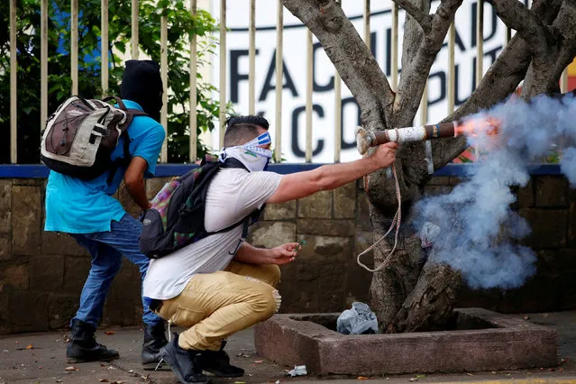 A demonstrator fires a homemade mortar towards riot police during a protest against Nicaragua's President Daniel Ortega's government in Managua, Nicaragua May 28, 2018. (Photo by Oswaldo Rivas/Reuters)