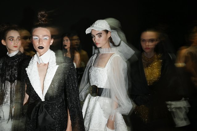 Models prepare backstage for the show of the Russian brand Barbino Maison during the Moscow Fashion Week at the Manezh exhibition hall in Moscow on October 9, 2024. (Photo by Natalia Kolesnikova/AFP Photo)