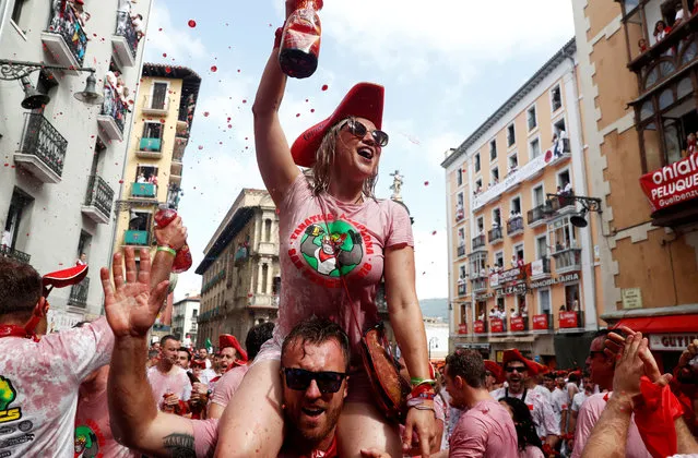 Revellers play and celebrate before the opening of the San Fermin festival in Pamplona, Spain on July 6, 2018. (Photo by Susana Vera/Reuters)