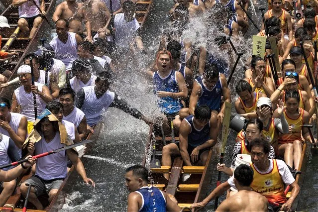 Competitors take part in the annual dragon boat race to celebrate the Tuen Ng festival in Hong Kong, Thursday, June 22, 2023. (Photo by Louise Delmotte/AP Photo)