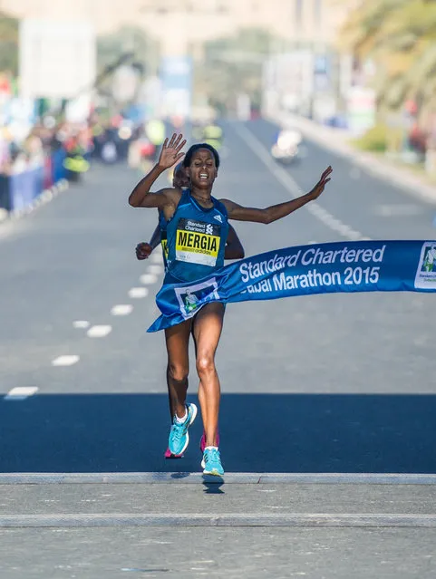 Aselefech Mergia Medessa of Ethiopia crosses the finish line to win the Women's Standard Chartered Dubai Marathon 2015 with a time of 2:20:02, held in Dubai, UAE, on Friday, January 23, 2015. (Photo by Stephen Hindley/AP Photo)