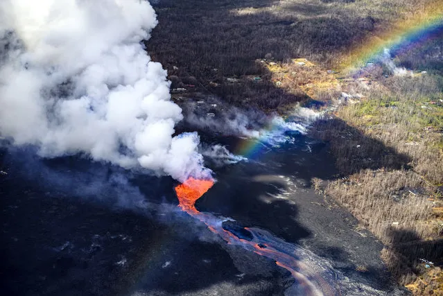 The Kilauea volcano on Hawaii’s Big Island erupted on May 3, 2018, and has continued to send lava over the surrounding neighborhoods. (Photo by CJ Kale/Caters News Agency)