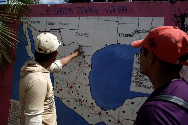Immigrants check a map of Mexico at the premises of a group called “Las Patronas” (The bosses), a charitable organization that feeds Central American immigrants on their way to the border with the United States who travel atop a freight train known as “La Bestia”, in Amatlan de los Reyes, in Veracruz state, Mexico October 22, 2016. (Photo by Daniel Becerril/Reuters)