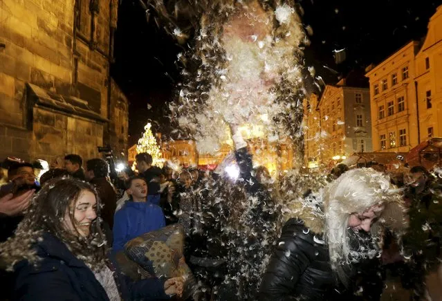 People take part in a four minute flash mob pillow fight at the Old Town Square in Prague, December 22, 2015. (Photo by David W. Cerny/Reuters)