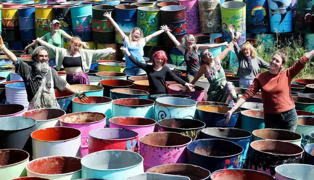 Glastonbury festival bin painters enjoy the sunshine on June 8, 2023 in Somerset, England, as they prepare for this years event, which gets underway later this month. (Photo by Jason Bryant/Apex News)