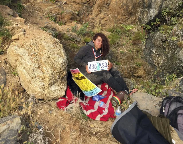 This Friday, July 13, 2018 photo by Chad Moore shows 23-year-old Angela Hernandez of Portland, Ore., after she survived a 250-foot car plunge off a cliff and a week stranded on a remote beach near Big Sur, Calif. Moore and his wife Chelsea Moore were camping in Big Sur when they came upon a wrecked Jeep in the surf line, and then a bit later found Hernandez. “We freakin' love that beach and we're so glad she's alive”, Chelsea Moore said Monday, July 16, 2018. (Photo by Chad Moore via AP Photo)