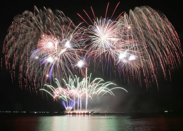 Fireworks from the Philippines light up the sky at the start of the 6th Pyro musical competition Saturday, February 7, 2015 at the Mall of Asia shopping complex at suburban Pasay city south of Manila, Philippines. (Photo by Bullit Marquez/AP Photo)