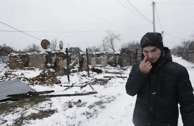 In this picture taken, Monday, February 9, 2015, Ruslan Banin, 18 years old, walks in his neighborhood  in Donetsk, Ukraine. (Photo by Petr David Josek/AP Photo)
