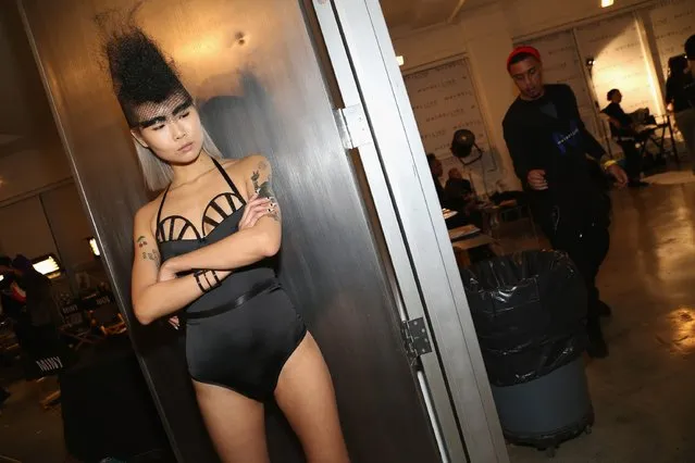 A model poses for a picture backstage at the Chromat AW15: Mindware fashion show during Mercedes-Benz Fashion Week Fall 2015 at Milk Studios on February 13, 2015 in New York City. (Photo by Monica Schipper/Getty Images for Chromat)