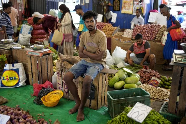 A vendor waits for customers at a market place in Colombo, Sri Lanka, Thursday, June. 1, 2023. The Central Bank of Sri Lanka reduced its interest rates Thursday, June 1, 2023, for the first time since the island nation declared bankruptcy last year. Stern fiscal controls, improved foreign currency income and help from an International Monetary Fund program has resulted in inflation slowing faster than expected. (Photo by Eranga Jayawardena/AP Photo)