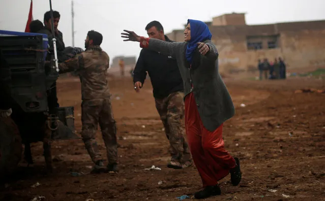 An Iraqi woman reacts as she rushes to a field hospital to see her daughters who were wounded during clashes in the Islamic State stronghold of Mosul, in al-Samah neighborhood, Iraq December 1, 2016. (Photo by Mohammed Salem/Reuters)