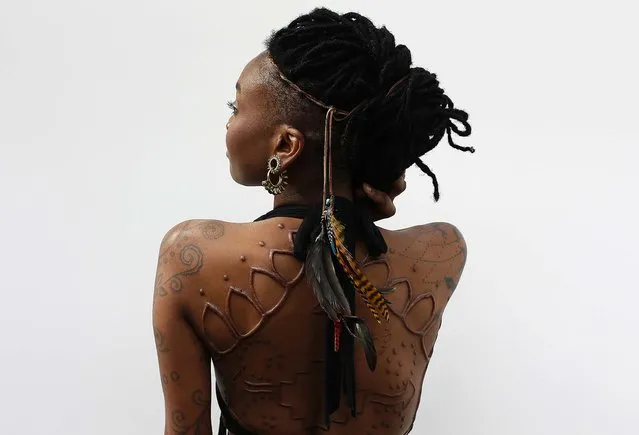 Model Moniasse displays her tattoos. (Photo by Stefan Wermuth/Reuters)