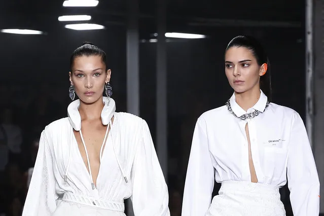 Models Bella Hadid, left, and Kendall Jenner wear creations for the Off White Spring/Summer 2019 ready to wear fashion collection presented in Paris, Thursday, September 27, 2018. (Photo by Thibault Camus/AP Photo)