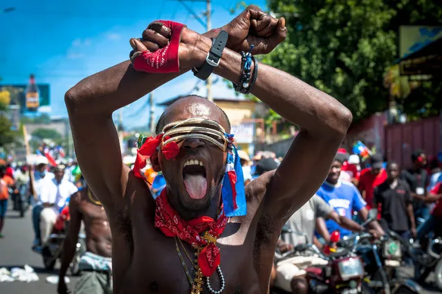 Haitians demonstrate during a protest to denounce the draft constitutional referendum carried by the President Jovenel Moise on March 28, 2021 in Port-au-Prince, Haiti. (Photo by Sabin Johnson/Anadolu Agency via Getty Images)