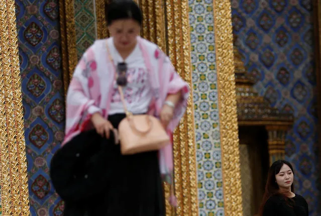 Chinese tourists visit the Temple of the Emerald Buddha in Bangkok, Thailand on August 19, 2018. (Photo by Soe Zeya Tun/Reuters)