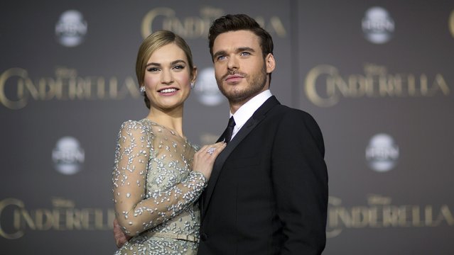 Cast members Lily James and Richard Madden pose at the premiere of "Cinderella" at El Capitan theatre in Hollywood, California March 1, 2015. The movie opens in the U.S. on March 13. REUTERS/Mario Anzuoni  (UNITED STATES - Tags: ENTERTAINMENT)