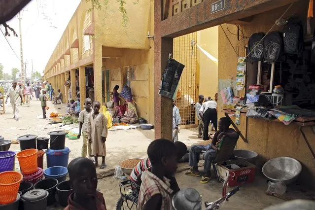 Vendors sell goods at the main market in Diffa, Niger, March 23, 2015. Diffa is where Nigerien and Chadian troops fighting insurgent group Boko Haram are based at. (Photo by Joe Penney/Reuters)