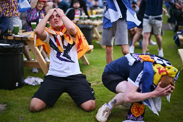 Scotland fans react as they support their team in the Euro 2020 game against England on June 18, 2021 in Glasgow, Scotland. England V Scotland is not only the oldest fixture in the world, they have also played one another more than any other two international teams.  Their first encounter was played in 1872 at Hamilton Crescent, Glasgow and their 115th match today at Wembley for Euro 2020. (Photo by Jeff J. Mitchell/Getty Images)