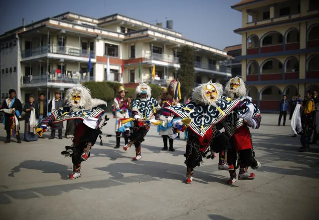 Tibetans perform traditional mask dance during a function organised to mark “Losar” or the Tibetan New Year in Kathmandu, Nepal, February 11, 2016. (Photo by Navesh Chitrakar/Reuters)