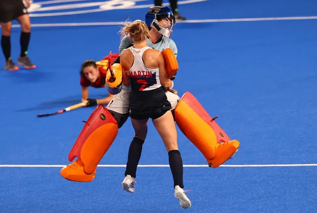 Hannah Martin and Madeleine Hinch of Britain celebrate after winning their hockey shoot-out versus Spain at Oi Hockey Stadium in Tokyo, Japan on August 2, 2021. (Photo by Bernadett Szabo/Reuters)