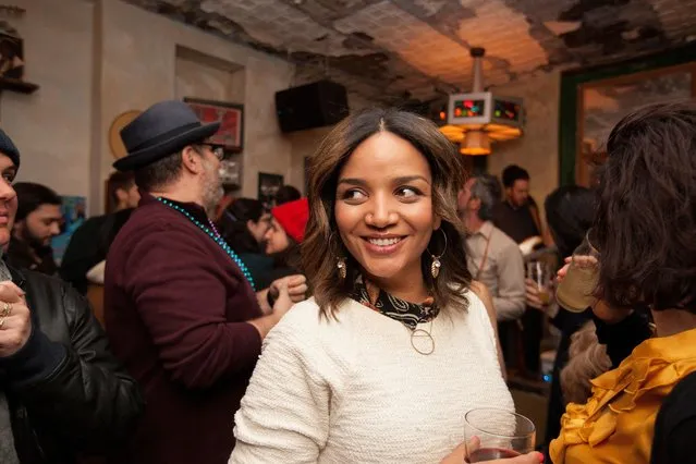 Cindy Santos, 39, stands among a crowd at a bar in Brooklyn, New York, U.S., March 5, 2019. (Photo by Jillian Kitchener/Reuters)