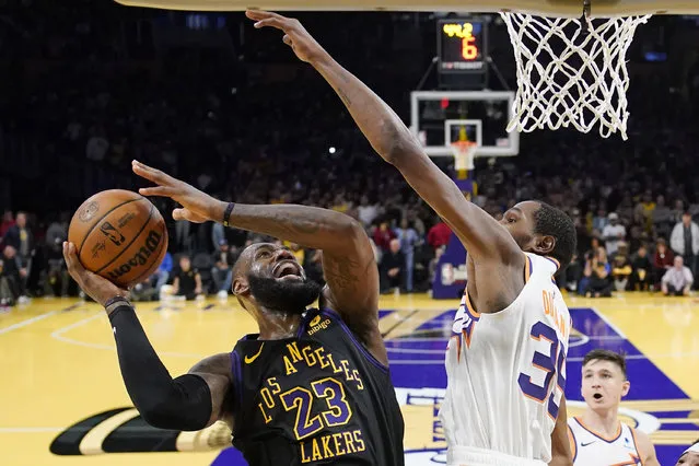 Los Angeles Lakers forward LeBron James, left, shoots as Phoenix Suns forward Kevin Durant defends during the second half of an NBA basketball In-Season Tournament quarterfinal game Tuesday, December 5, 2023, in Los Angeles. (Photo by Mark J. Terrill/AP Photo)