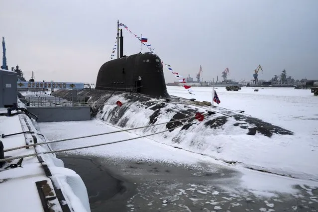 The newly-built nuclear submarine The Krasnoyarsk is seen after a flag-raising ceremony on Monday for newly-built nuclear submarines at the Sevmash shipyard in Severodvinsk in Russia's Archangelsk region, Monday, December 11, 2023. The navy flag was raised on the Emperor Alexander III and the Krasnoyarsk submarines during Monday's ceremony. Putin has traveled to a northern shipyard to attend the commissioning of new nuclear submarines, a visit that showcases the country's nuclear might amid the fighting in Ukraine. (Photo by Kirill Iodas, Sputnik, Kremlin Pool Photo via AP Photo)