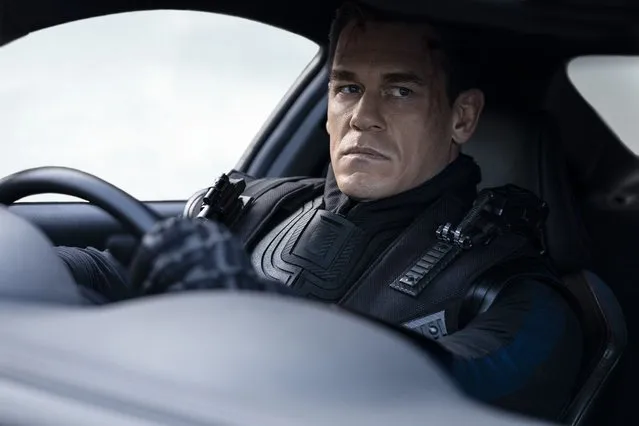 This image released by Universal Pictures shows John Cena in a scene from “F9: The Fast Saga”. (Photo by Giles Keyte/Universal Pictures via AP Photo)