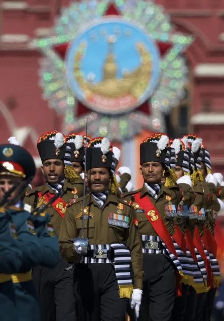 Indian army soldiers march along the Red Square during a general rehearsal for the Victory Day military parade which will take place at Moscow's Red Square on May 9 to celebrate 70 years after the victory in WWII, in Moscow, Russia, Thursday, May 7, 2015. (Photo by Ivan Sekretarev/AP Photo)
