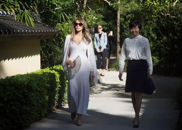 US First Lady Melania Trump (L) and Akie Abe, wife of Japanese Prime Minister Shinzo Abe, tour Morikami Museum and Japanese Gardens in Delray Beach, Florida, on February 11, 2017. (Photo by Gaston De Cardenas/AFP Photo)