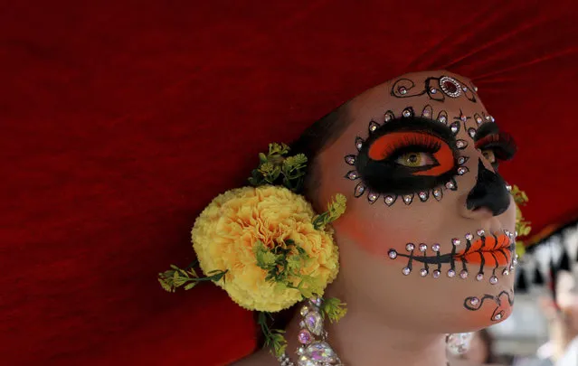 A reveler dressed as a Mexican “catrina” participates in the gay pride parade in Bogota, Colombia, Sunday, June 30, 2019. Thousands paraded during the annual gay pride parade in support of peace and against sexual discrimination. (Photo by Fernando Vergara/AP Photo)