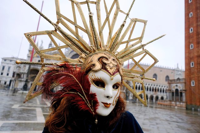 A person wears a carnival mask in St. Mark's Square to celebrate Venice's annual colourful carnival, which has been cancelled this year due to the coronavirus disease (COVID-19) pandemic, in Venice, Italy, February 7, 2021. (Photo by Manuel Silvestri/Reuters)