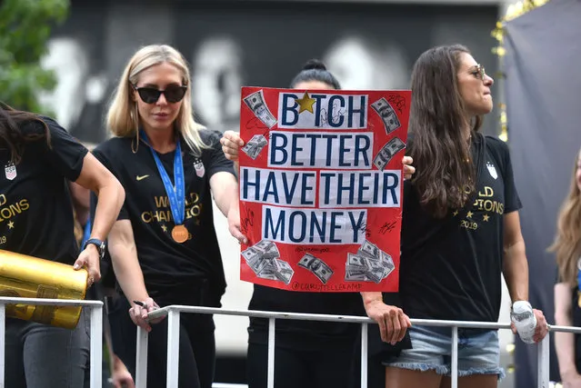 US Women’s soccer team celebrate during a Victory Ticker Tape Parade for the U.S. Women's National Soccer Team down the Canyon of Heroes on July 10, 2019 in New York City. In March, all 28 players on the women’s team filed a gender discrimination lawsuit against the US Soccer Federation, demanding their compensation be equal to that of their male counterparts. The lawsuit alleges that women players each earn a maximum of $99,000 total for a season, compared with an average of $263,320 for male players. (Photo by Erik Pendzich/Rex Features/Shutterstock)